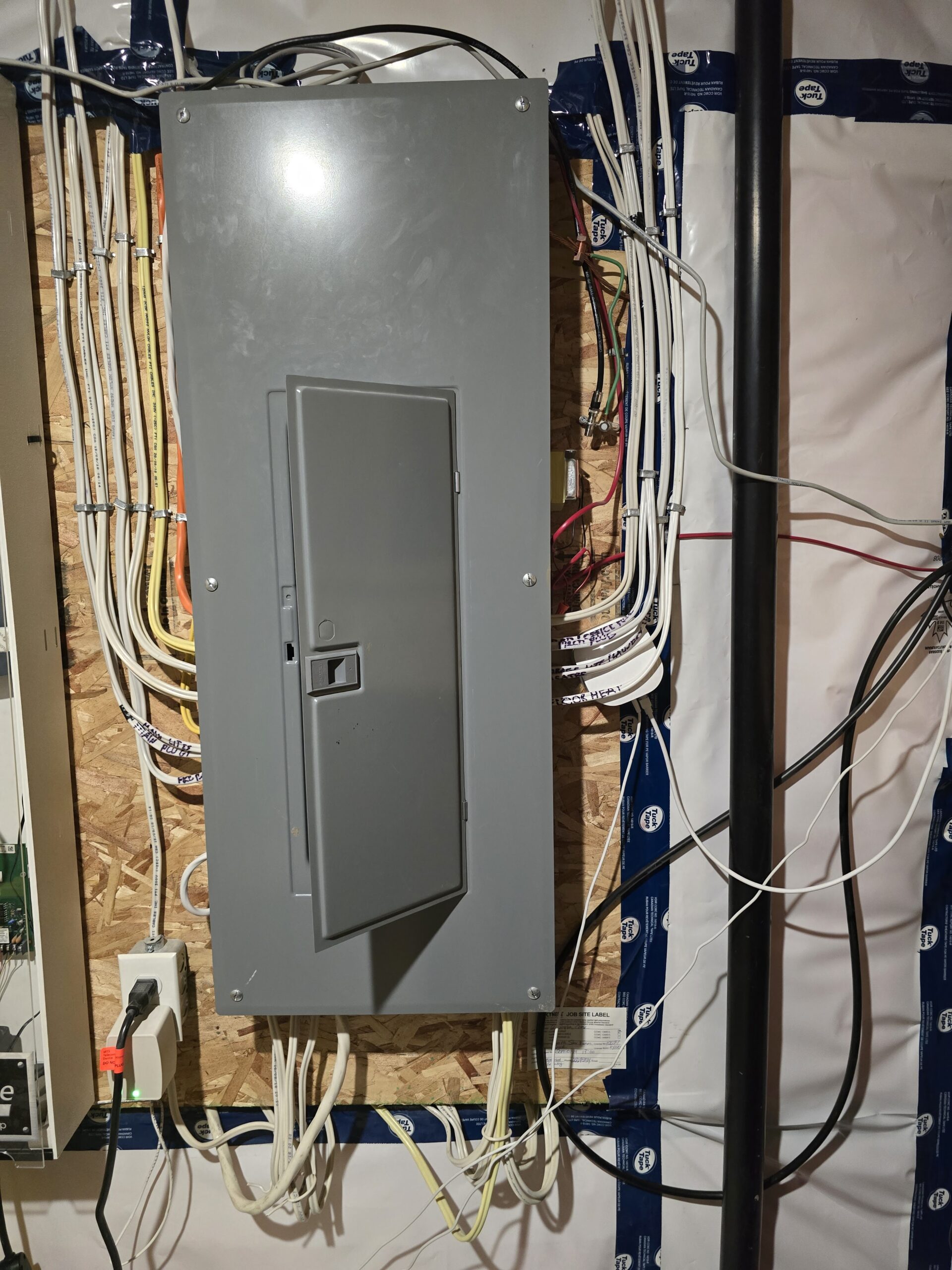 Electrical panel upgrade in Winnipeg home showing new breaker box with organized wiring – Sparxx Electrical Contractors